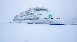 The ship Greg Mortimer parked in the fast ice.