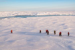 Guest walking on sea ice at North Pole. 