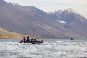 A zodiac in icy water in Greenland.