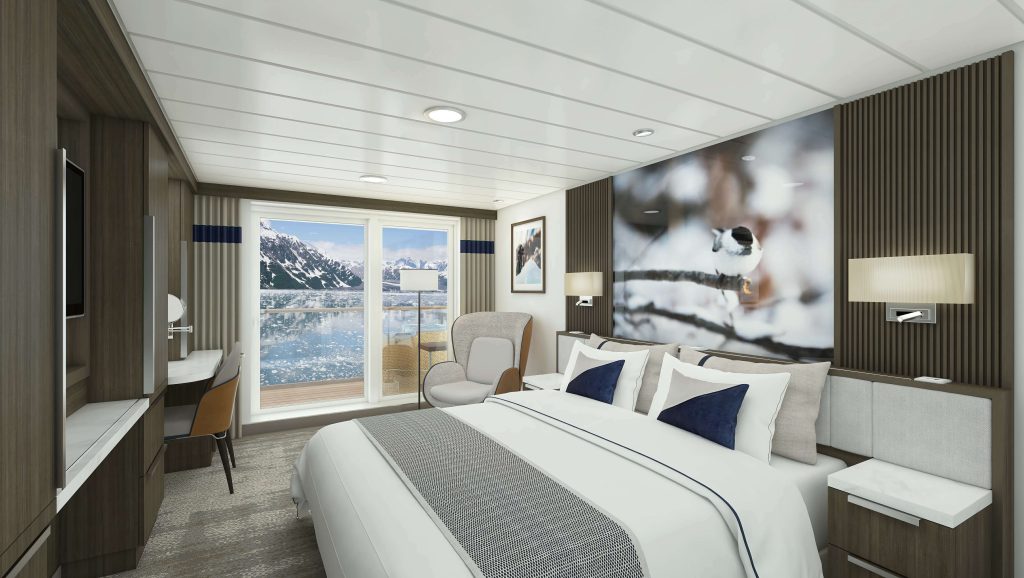 Bedroom with king bed and ocean views in Captain's Suite on Douglas Mawson.