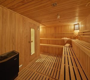 Sauna with long wooden bench seating on the Magellan Explorer