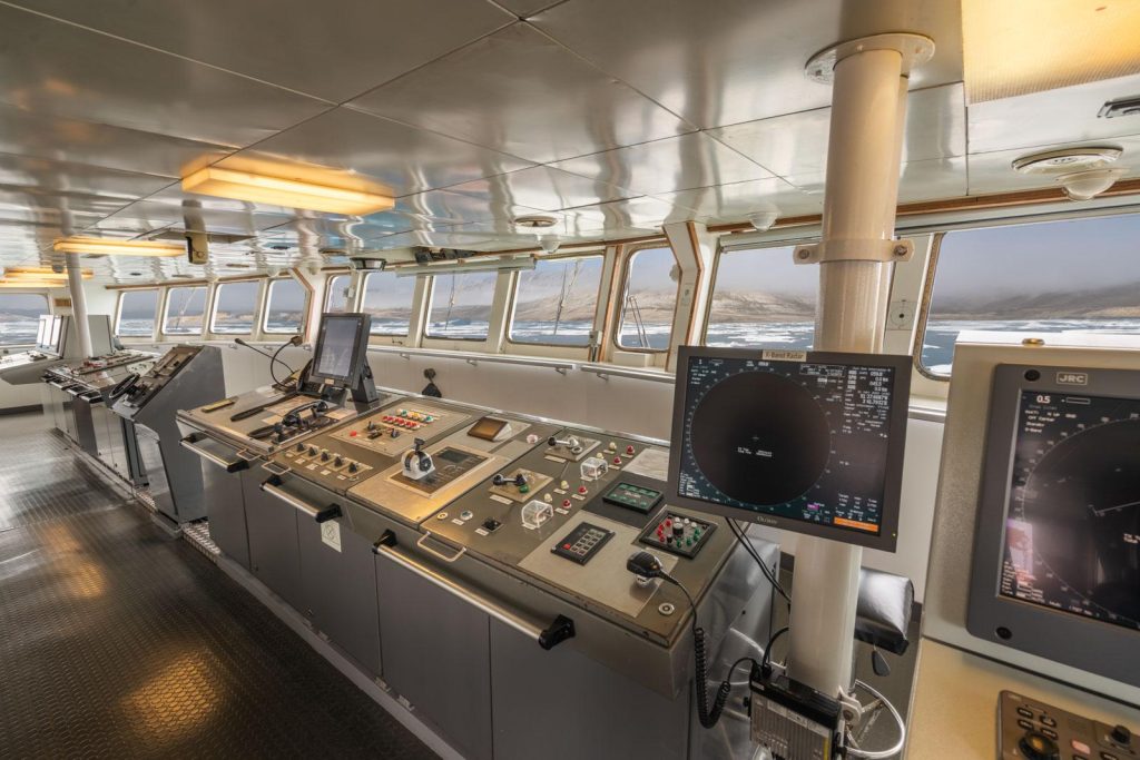 View of navigational equipment and windows in the bridge of the Ortelius.
