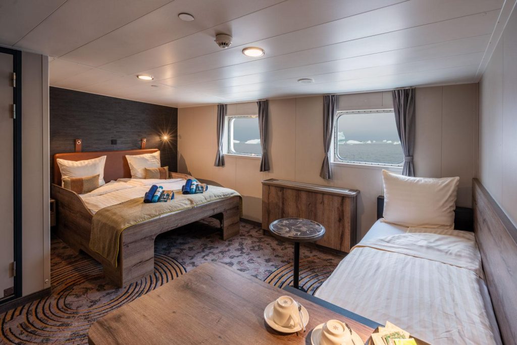 Superior cabin on Plancius with 1 double bed, single sofa bed and 2 windows.