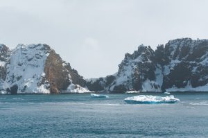 Antarctic landscape with iceberg.