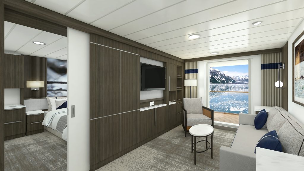 Sitting area with couch, TV and huge window in Junior Suite on Douglas Mawson.