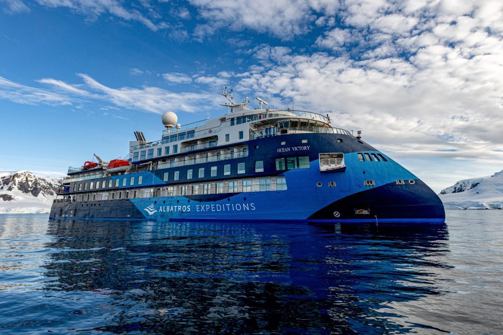The side view of the ship Ocean Victory from the water.